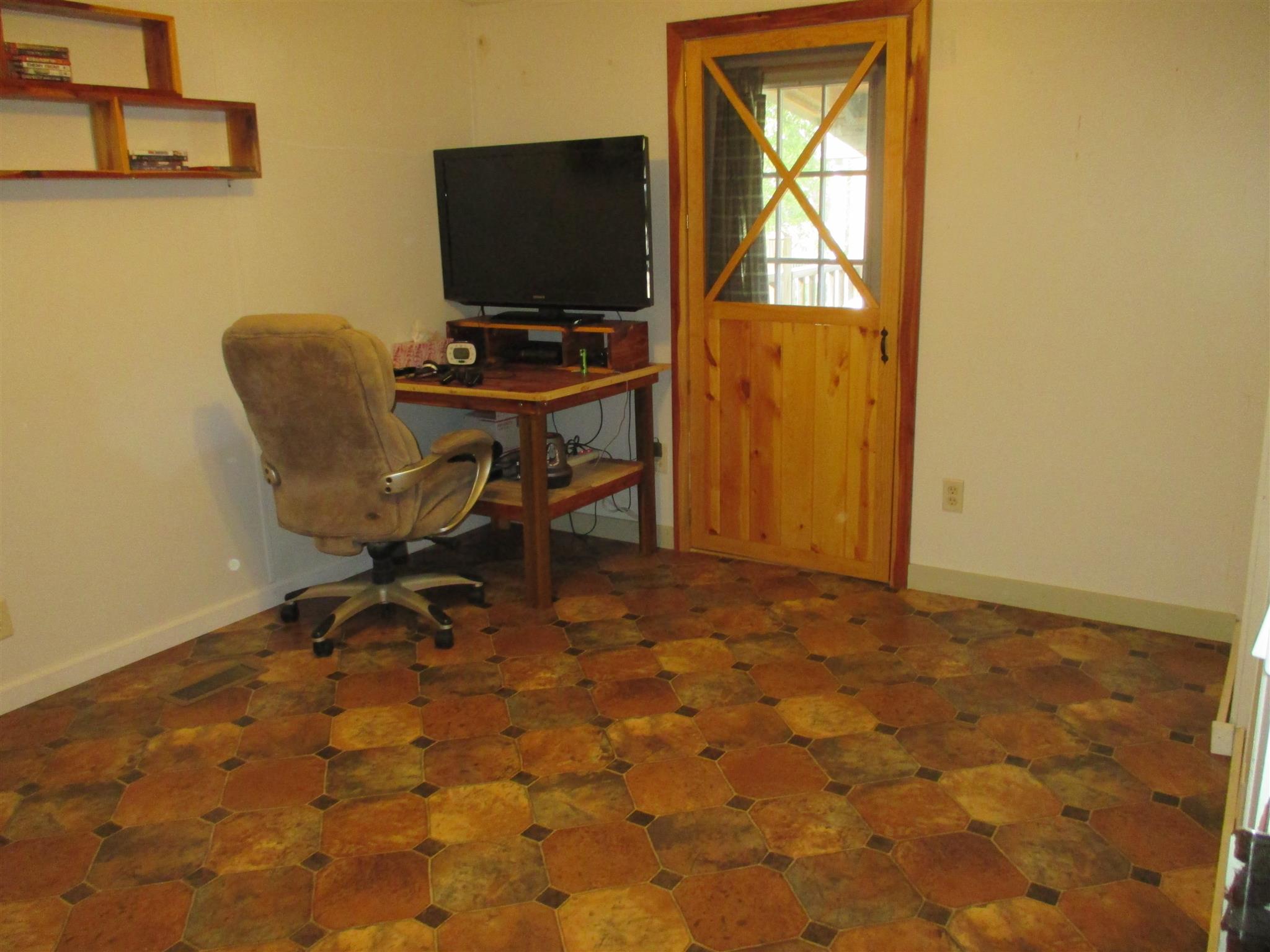 873 Prosser Road Leoma, TN 38468 - Photo 13 of 25 a workspace with furniture and a flat screen tv