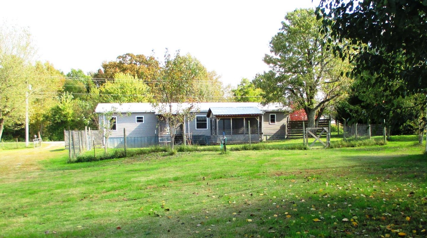 873 Prosser Road Leoma, TN 38468 - Photo 15 of 25 a backyard of a house with table and chairs