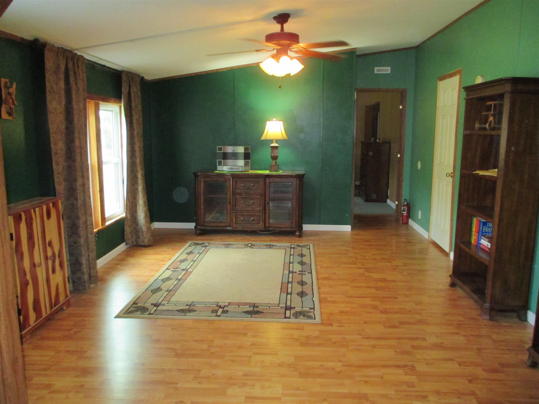 873 Prosser Road Leoma, TN 38468 - Photo 3 of 25 a view of a livingroom with a hall and a ceiling fan
