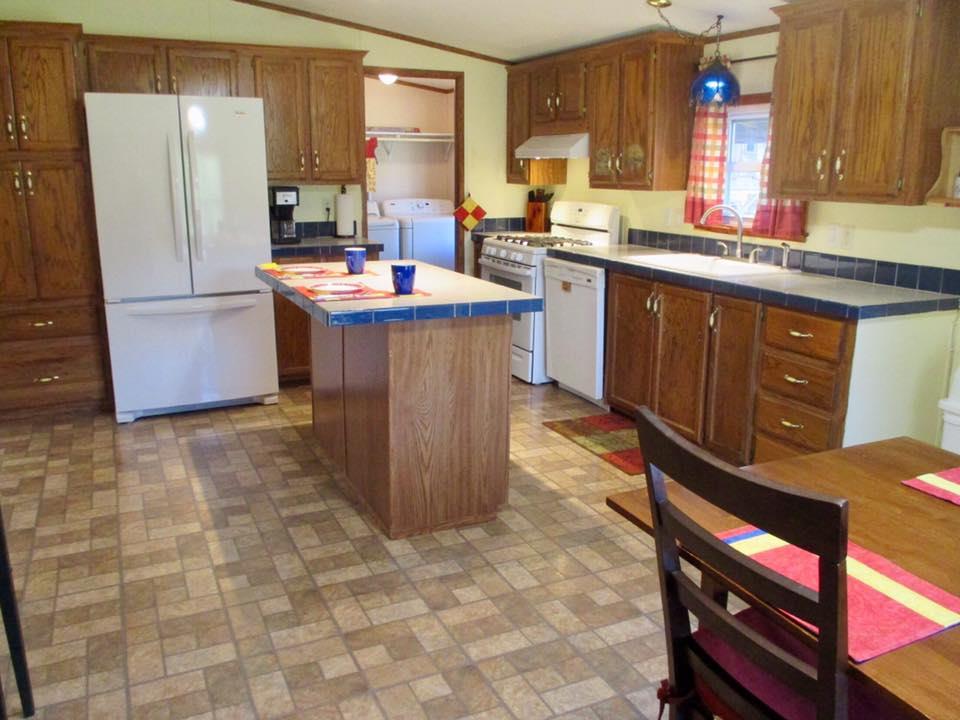 873 Prosser Road Leoma, TN 38468 - Photo 5 of 25 a kitchen with a sink refrigerator and cabinets