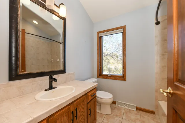 $580,500 | 5700 Woodland Hills Drive, Mount Pleasant, WI 53406