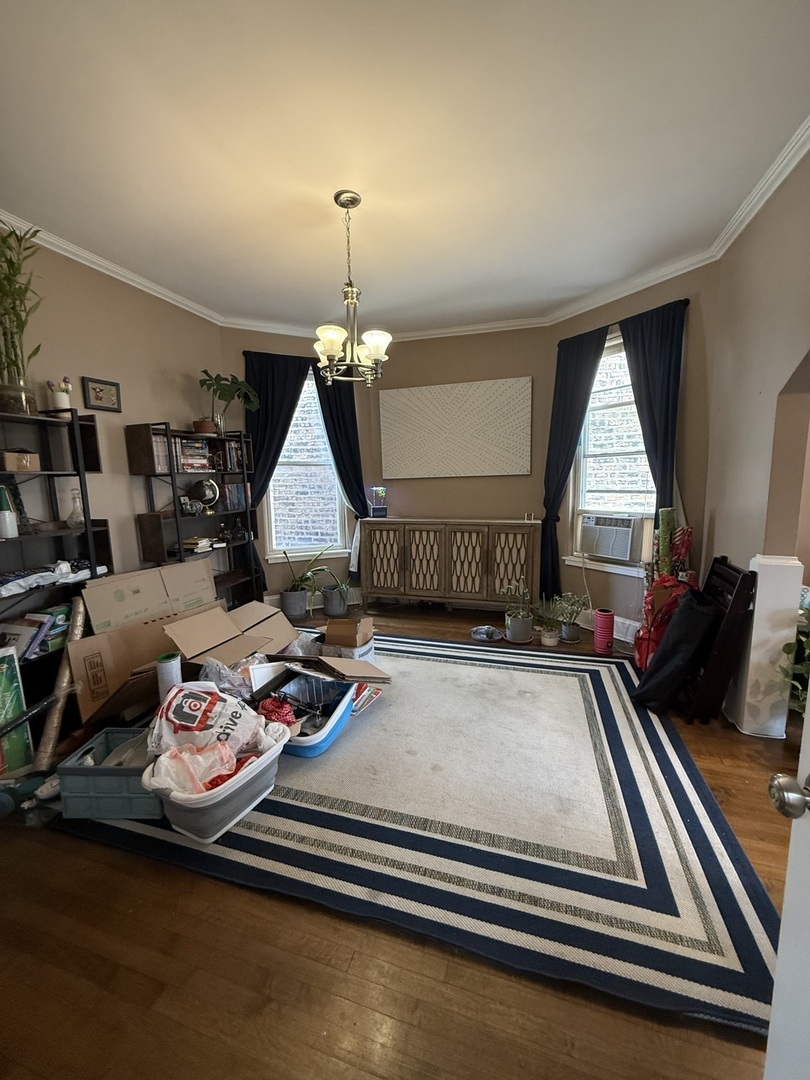 3252 West Crystal Street, Unit 2 Chicago, IL 60651 - Photo 4 of 13 a living room with furniture and wooden floor