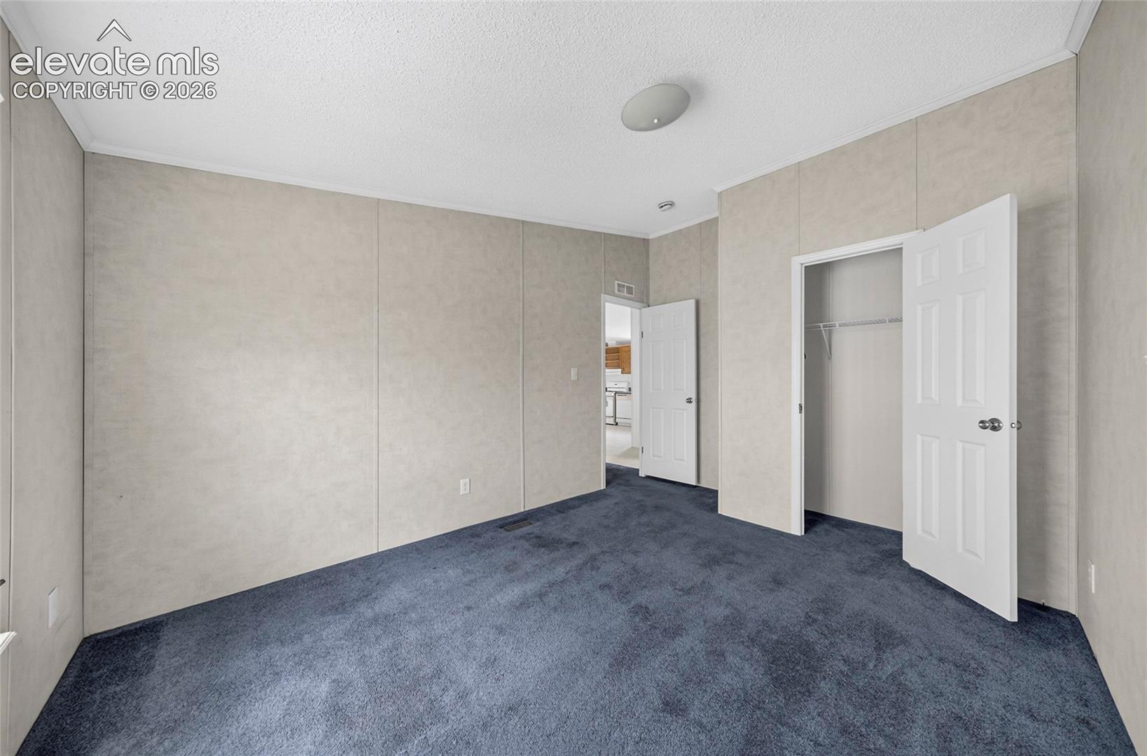 41751 Harbour Road Avondale, CO 81022 - Photo 12 of 41 Carpeted flooring, paneled walls, and a built-in closet