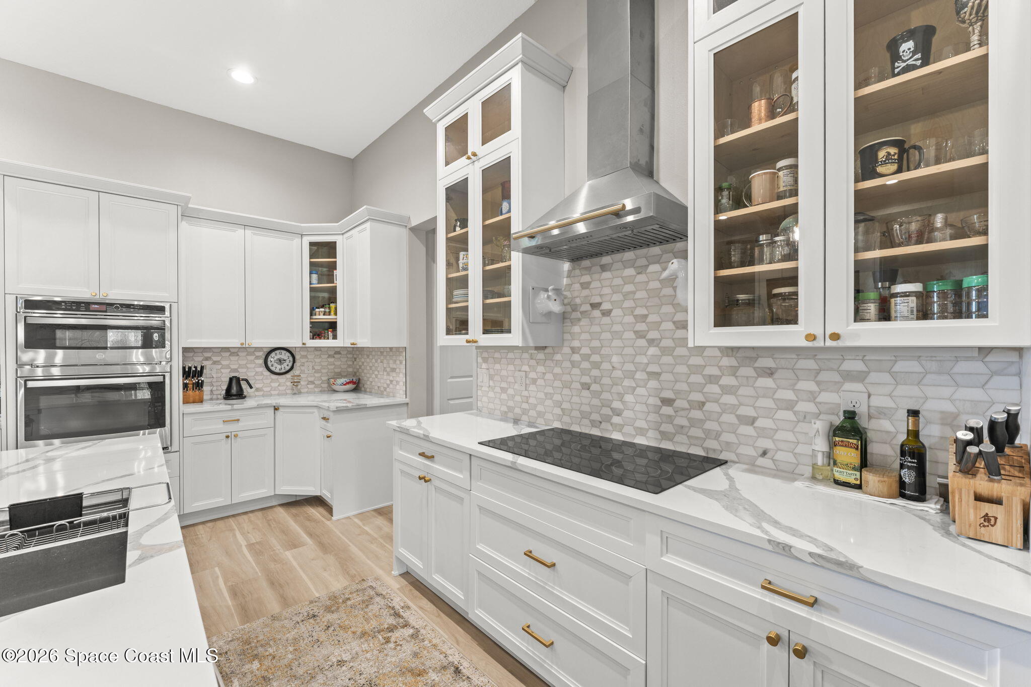 1740 Ford Road Mims, FL 32754 - Photo 16 of 43 a kitchen with stainless steel appliances kitchen island granite countertop a sink and cabinets