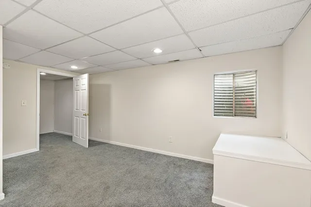 a view of a livingroom with a washer and dryer