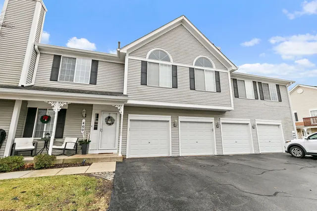 a view of a white house with a large windows
