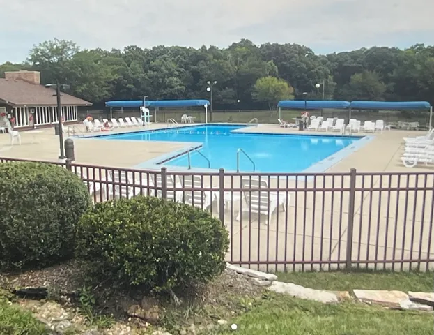 a view of a swimming pool with a patio