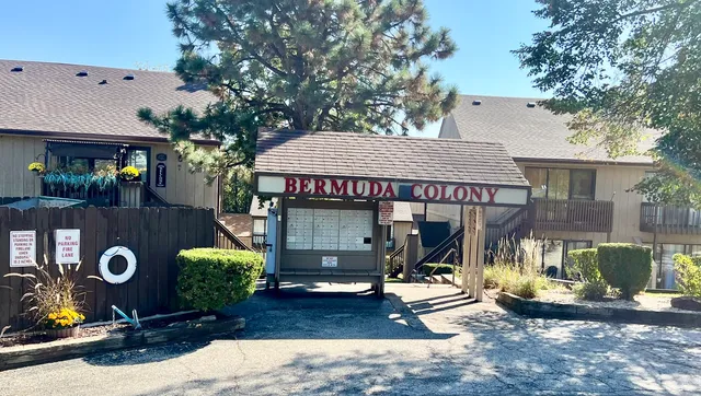 a view of a house with backyard outdoor seating area and furniture