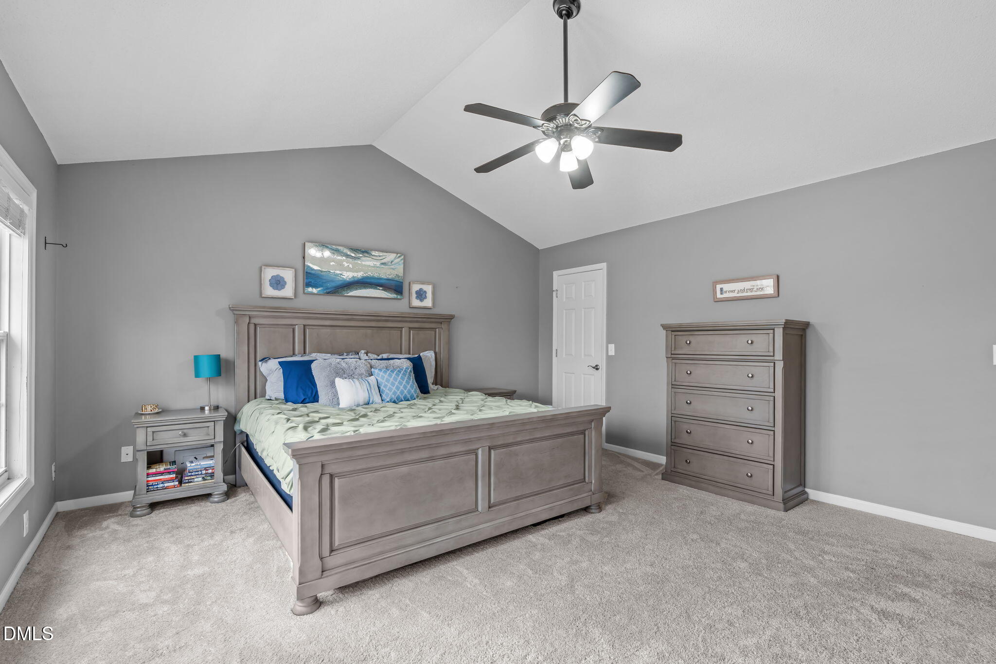 2501 Springfield Park Drive Raleigh, NC 27614 - Photo 31 of 44 a bedroom with a bed and a chandelier