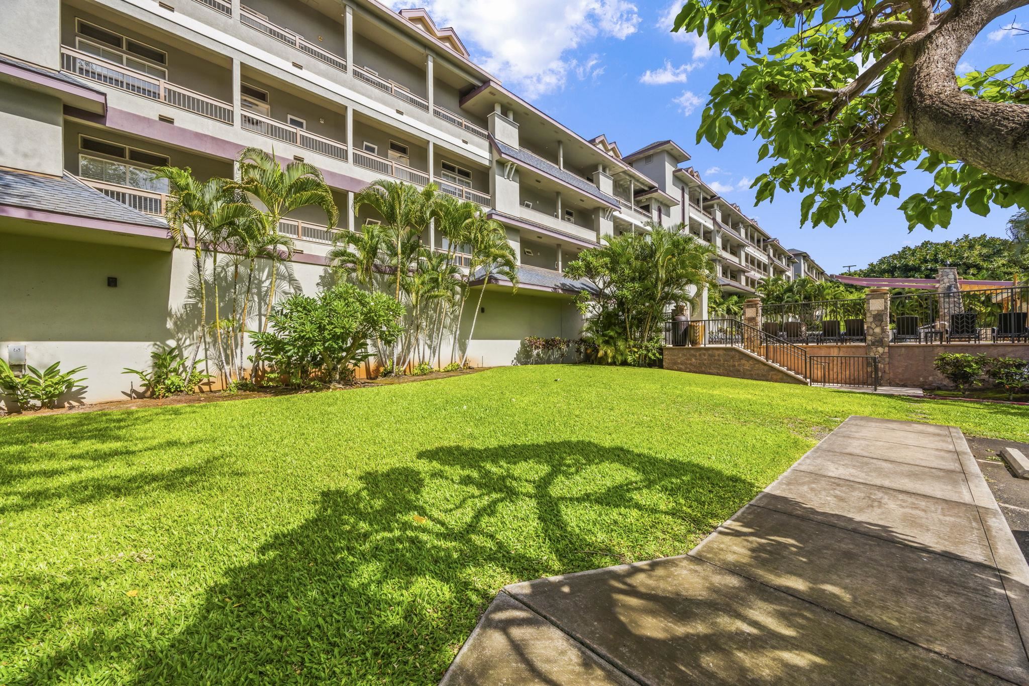 3708 Lower Honoapiilani Road, Unit E33 Lahaina, HI 96761 - Photo 15 of 36 a view of a building with a garden