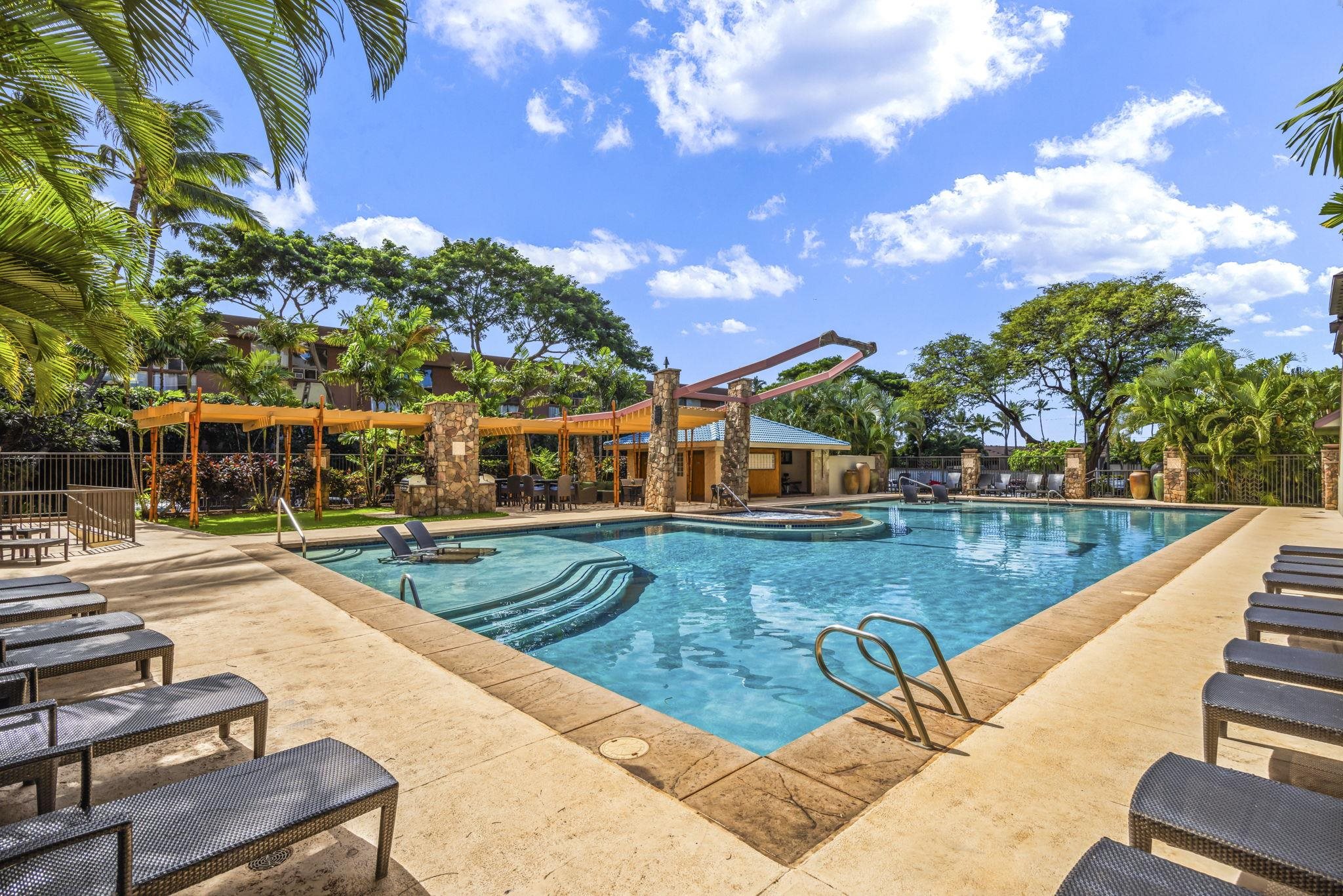 3708 Lower Honoapiilani Road, Unit E33 Lahaina, HI 96761 - Photo 30 of 36 a view of a swimming pool with a patio