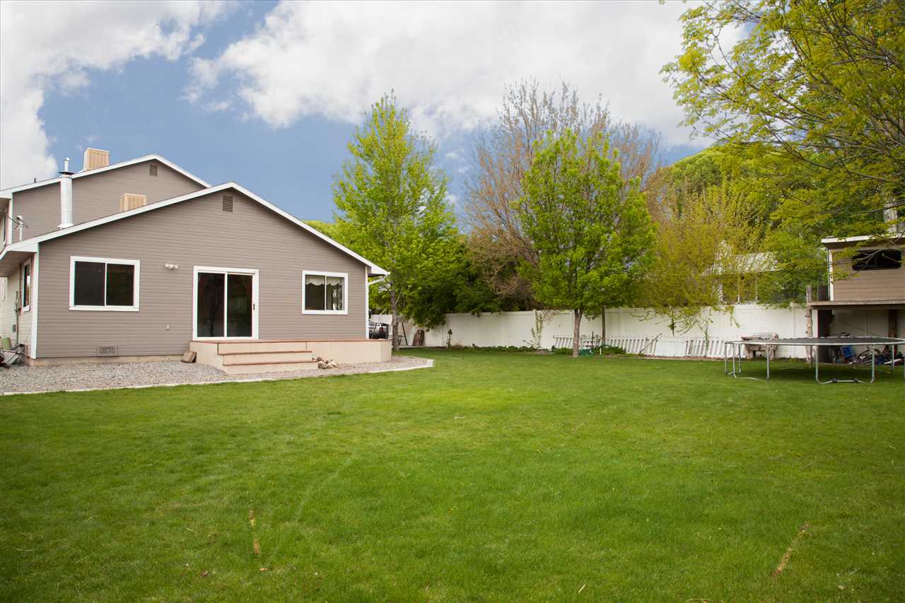 577 29 Road Grand Junction, CO 81501 - Photo 16 of 17 a front view of a house with a garden