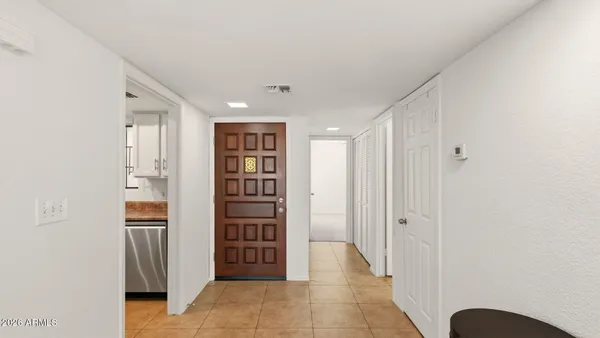 a view of a hallway with closet