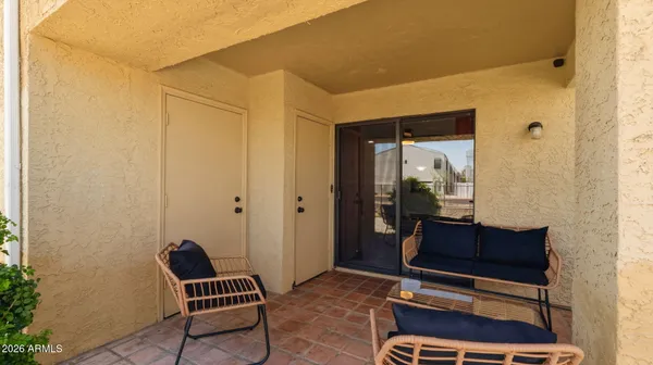 a view of a livingroom with furniture and front door