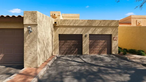 a view of a hallway with a ceiling fan
