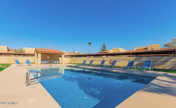 a spacious bathroom with a glass shower door and a mirror