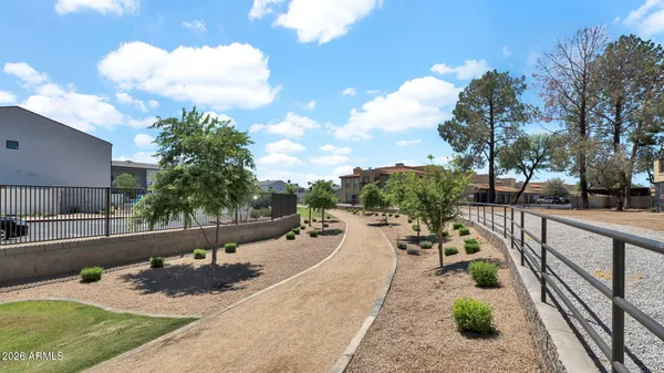 a view of a street with a yard