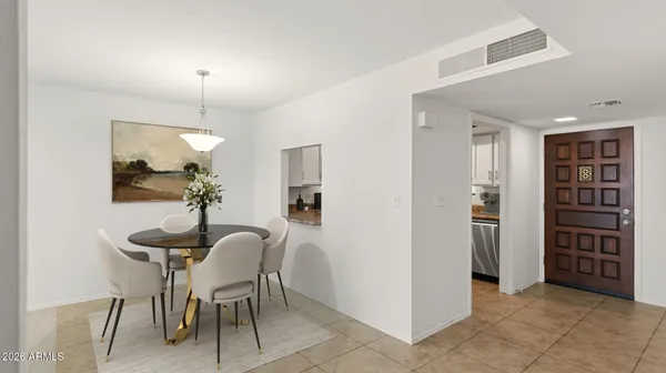 a view of a livingroom with furniture and staircase