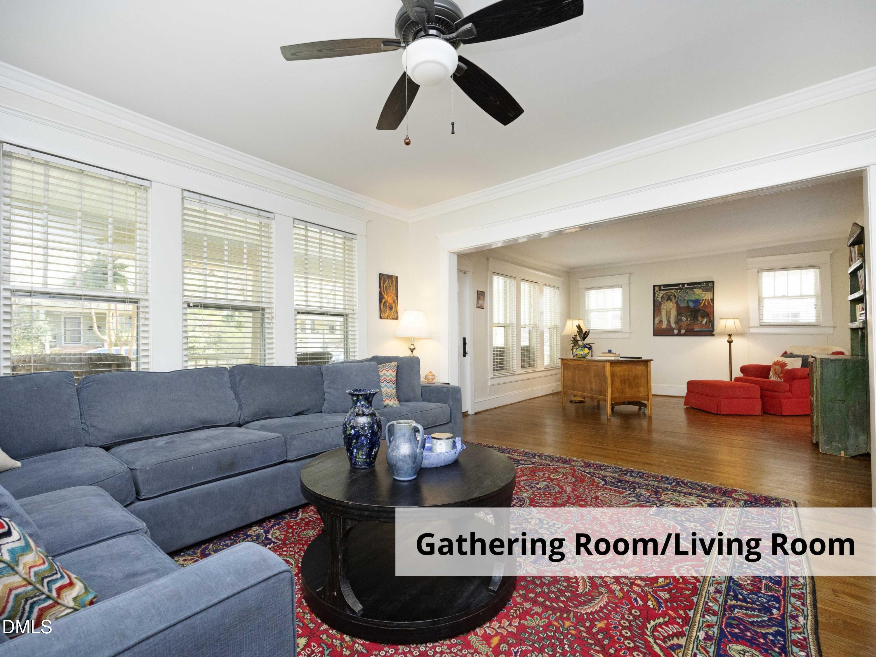 825 Onslow Street Durham, NC 27705 - Photo 13 of 71 a living room with furniture a rug and a chandelier
