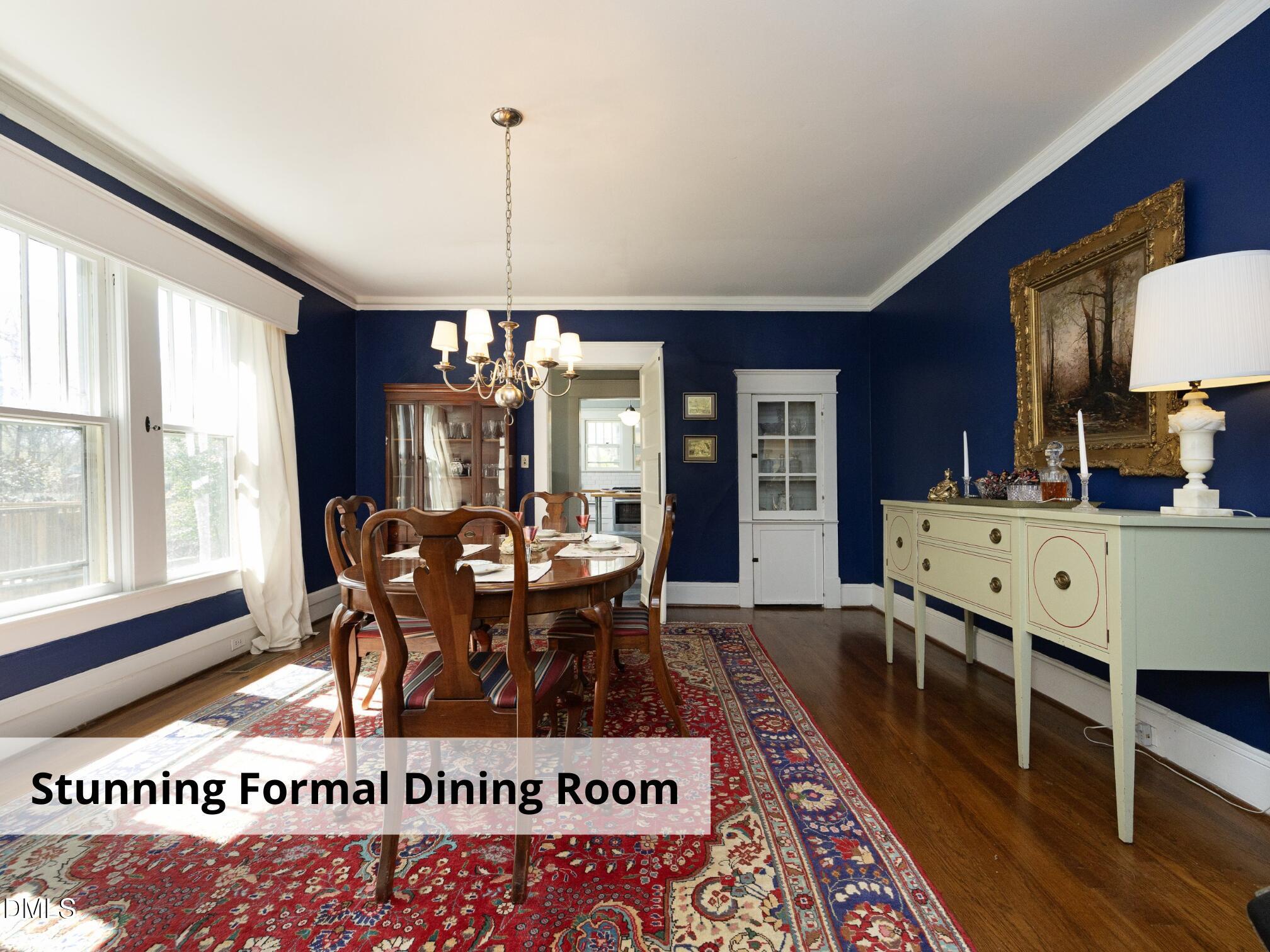 825 Onslow Street Durham, NC 27705 - Photo 16 of 71 a living room with furniture a rug a chandelier and a large window