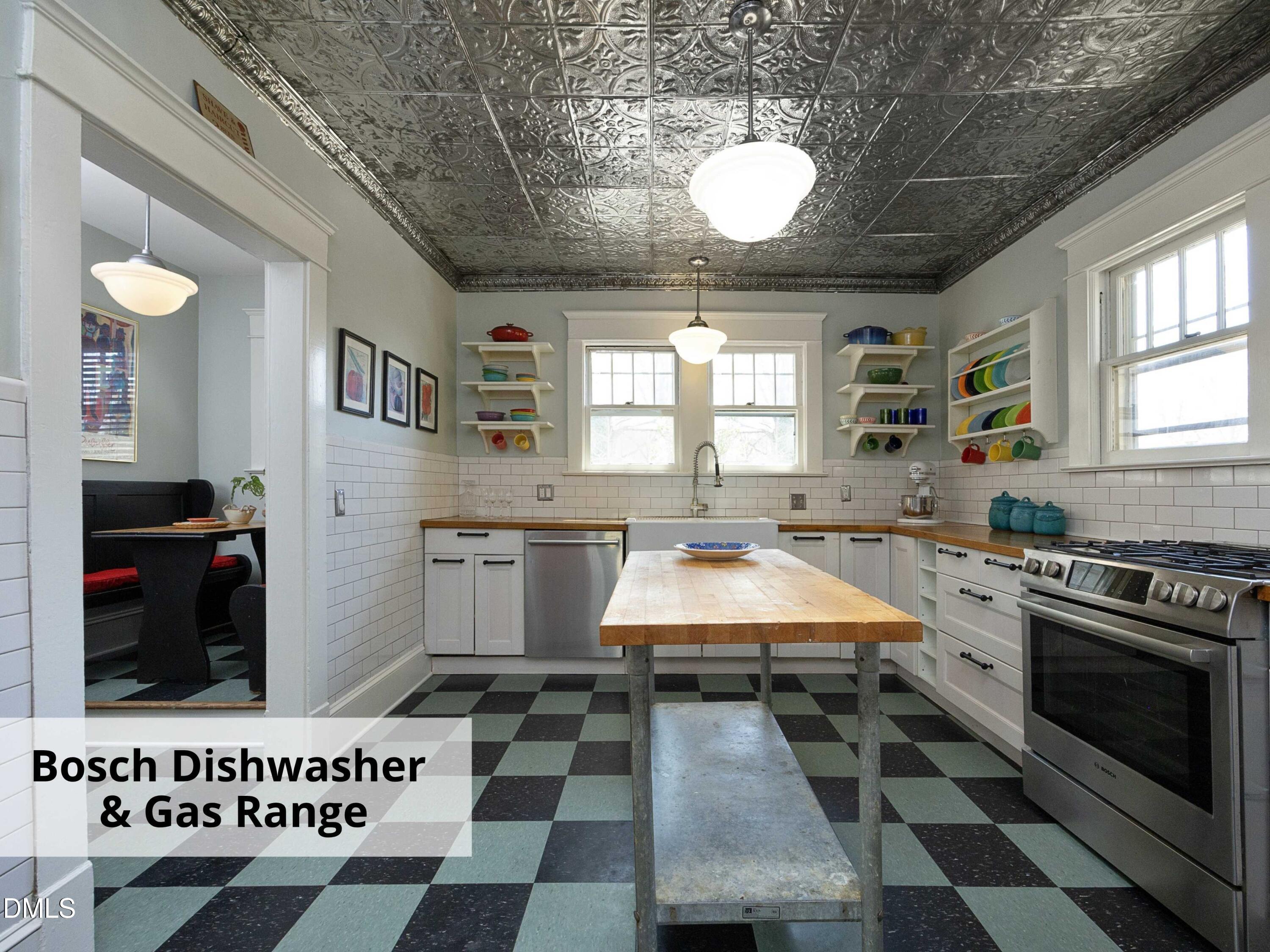 825 Onslow Street Durham, NC 27705 - Photo 24 of 71 a kitchen with a stove a sink and a microwave