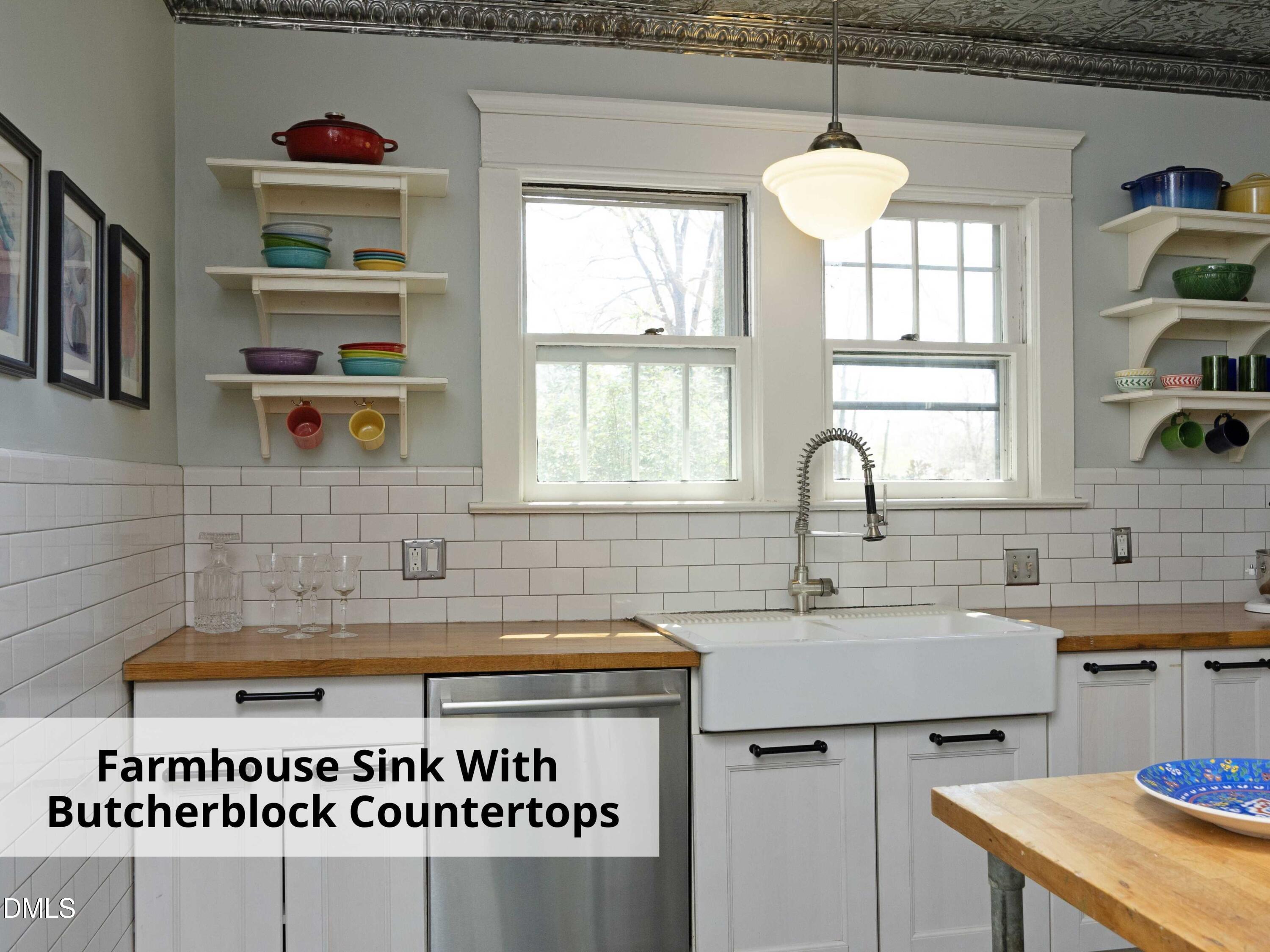 825 Onslow Street Durham, NC 27705 - Photo 26 of 71 a kitchen with a sink a stove and a window