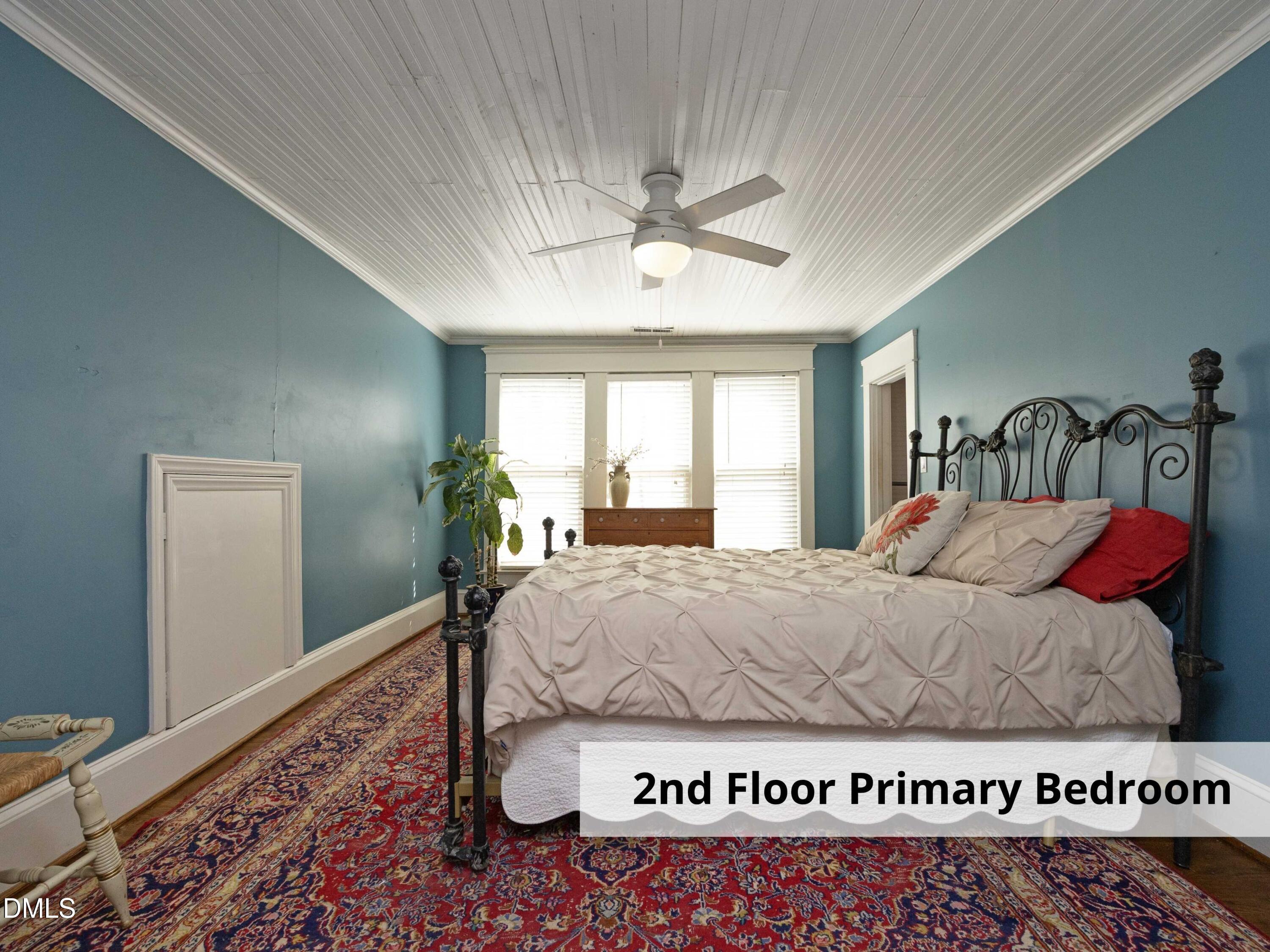 825 Onslow Street Durham, NC 27705 - Photo 40 of 71 a bed sitting in a bedroom next to a window
