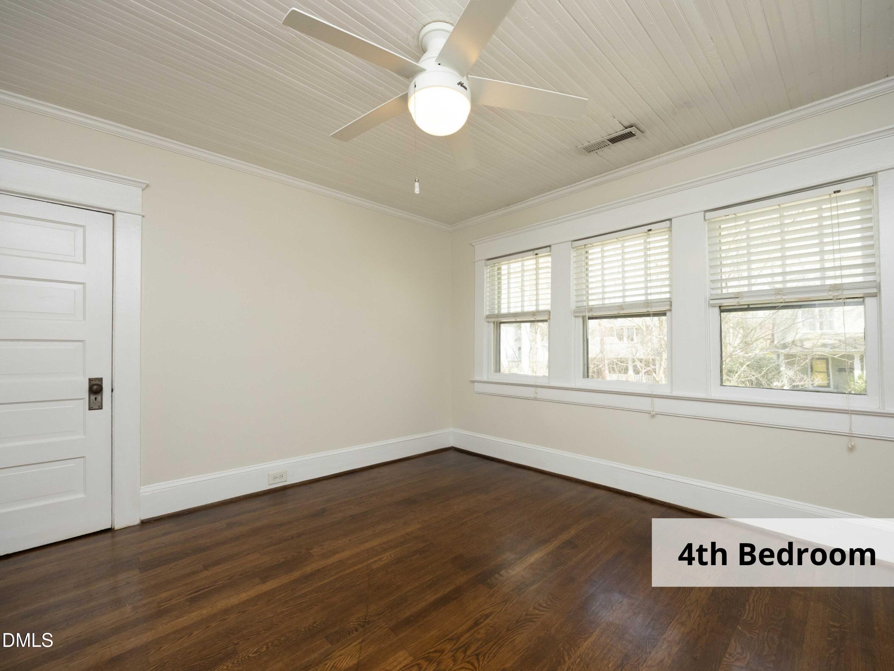 825 Onslow Street Durham, NC 27705 - Photo 42 of 71 an empty room with wooden floor and windows