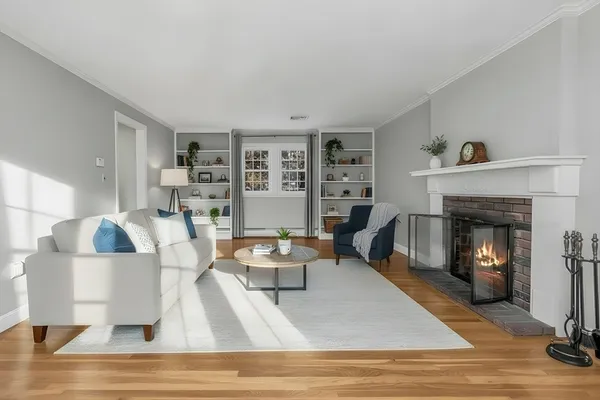 a living room with furniture and a fireplace