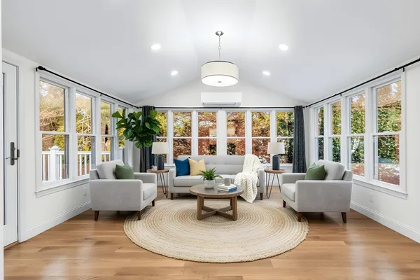 a living room with furniture and a large window