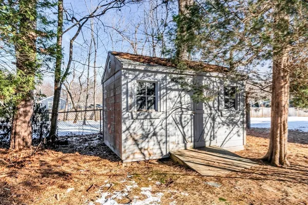 a backyard of a house with large trees