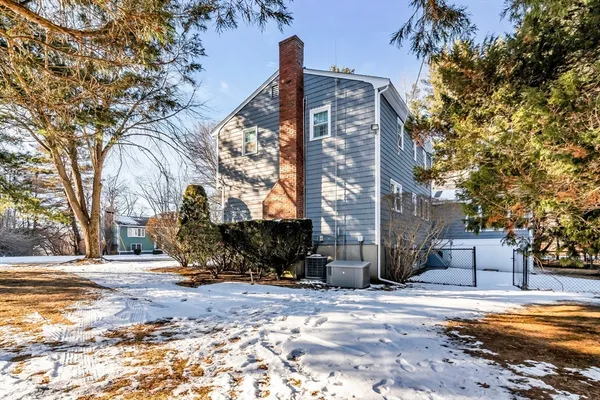 a view of a building with snow on the road