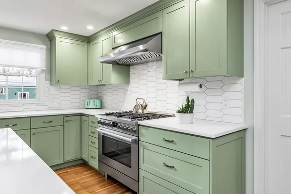 a kitchen with stainless steel appliances granite countertop a sink and cabinets