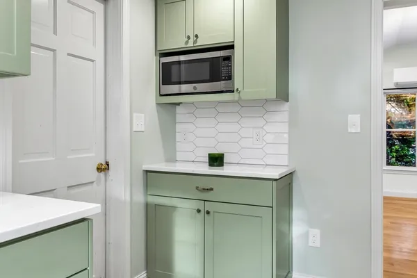 a kitchen with a sink and cabinets