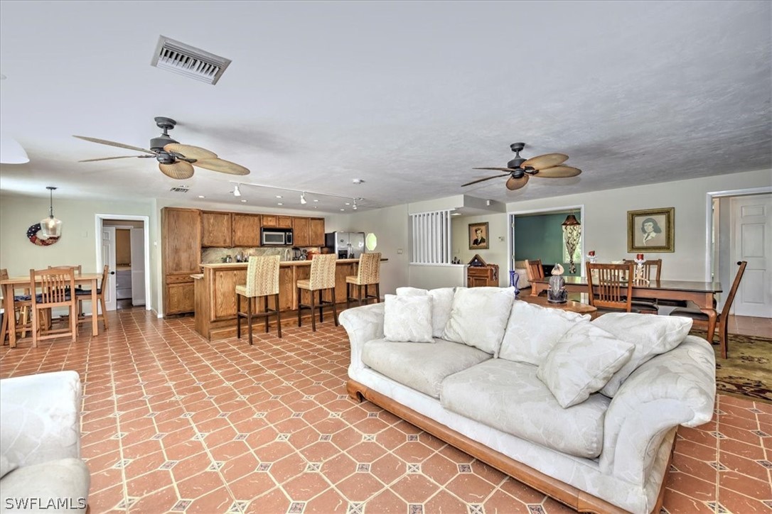12271 Coyle Road Fort Myers, FL 33905 - Photo 12 of 33 a living room with furniture and view of kitchen