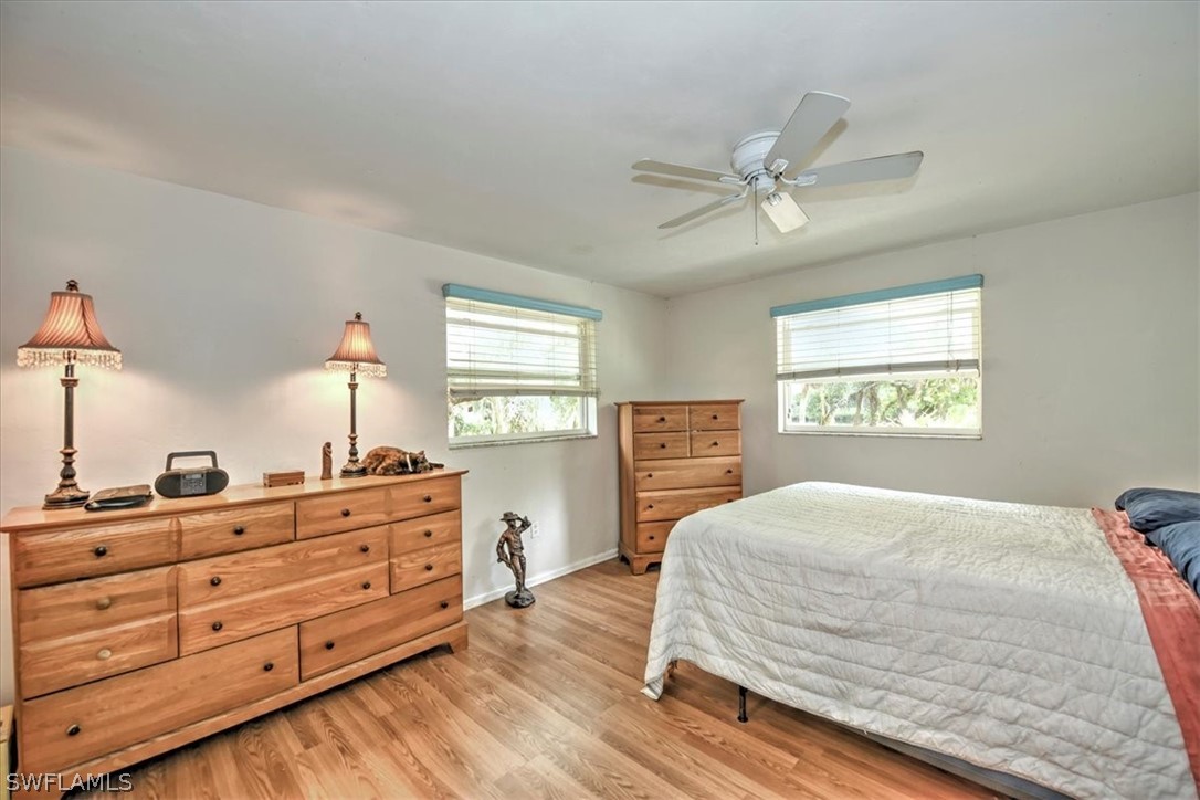 12271 Coyle Road Fort Myers, FL 33905 - Photo 16 of 33 a bedroom with a bed and window