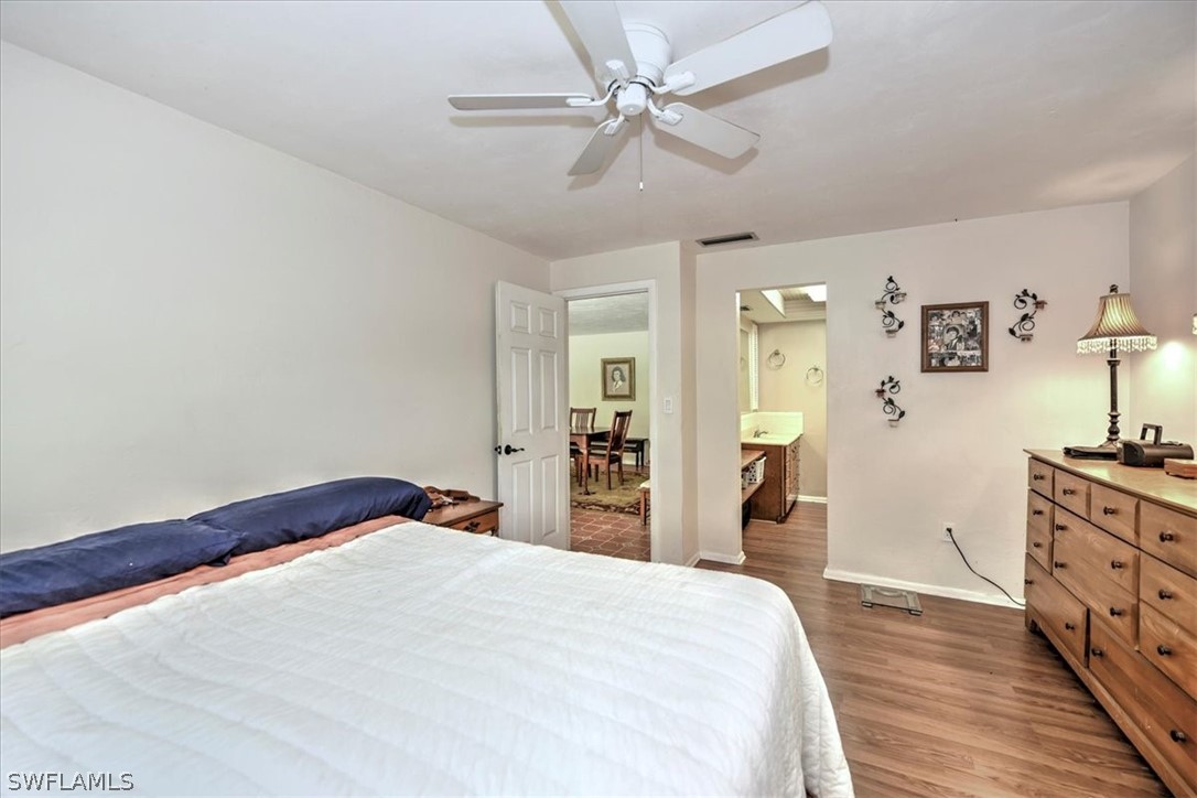 12271 Coyle Road Fort Myers, FL 33905 - Photo 17 of 33 a bedroom with a bed and a dresser