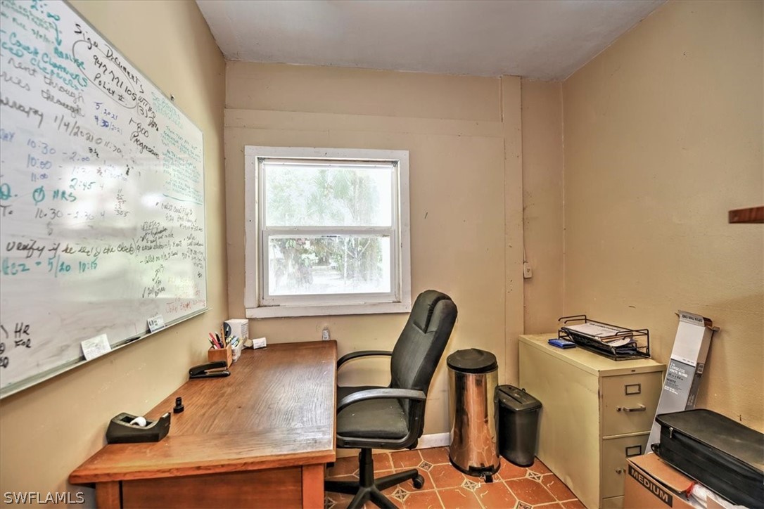 12271 Coyle Road Fort Myers, FL 33905 - Photo 25 of 33 a view of a workspace with furniture and a window
