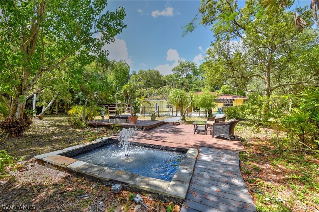 12271 Coyle Road Fort Myers, FL 33905 - Photo 27 of 33 a view of a yard with chairs