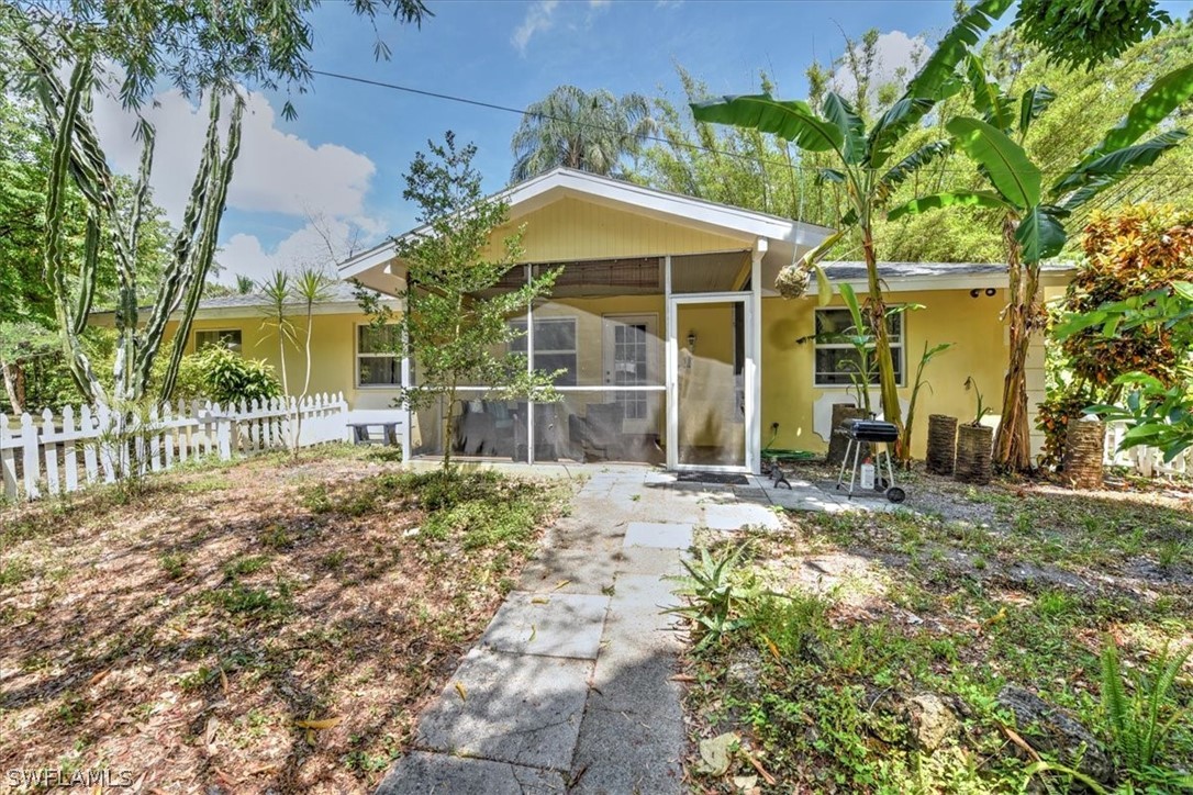 12271 Coyle Road Fort Myers, FL 33905 - Photo 30 of 33 a front view of a house with a yard