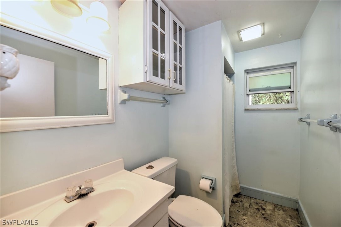 12271 Coyle Road Fort Myers, FL 33905 - Photo 31 of 33 a bathroom with a sink and a toilet