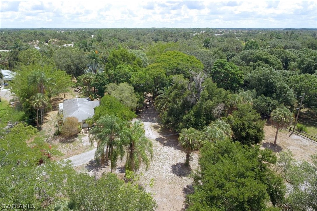 12271 Coyle Road Fort Myers, FL 33905 - Photo 8 of 33 an aerial view of residential houses with outdoor space and trees