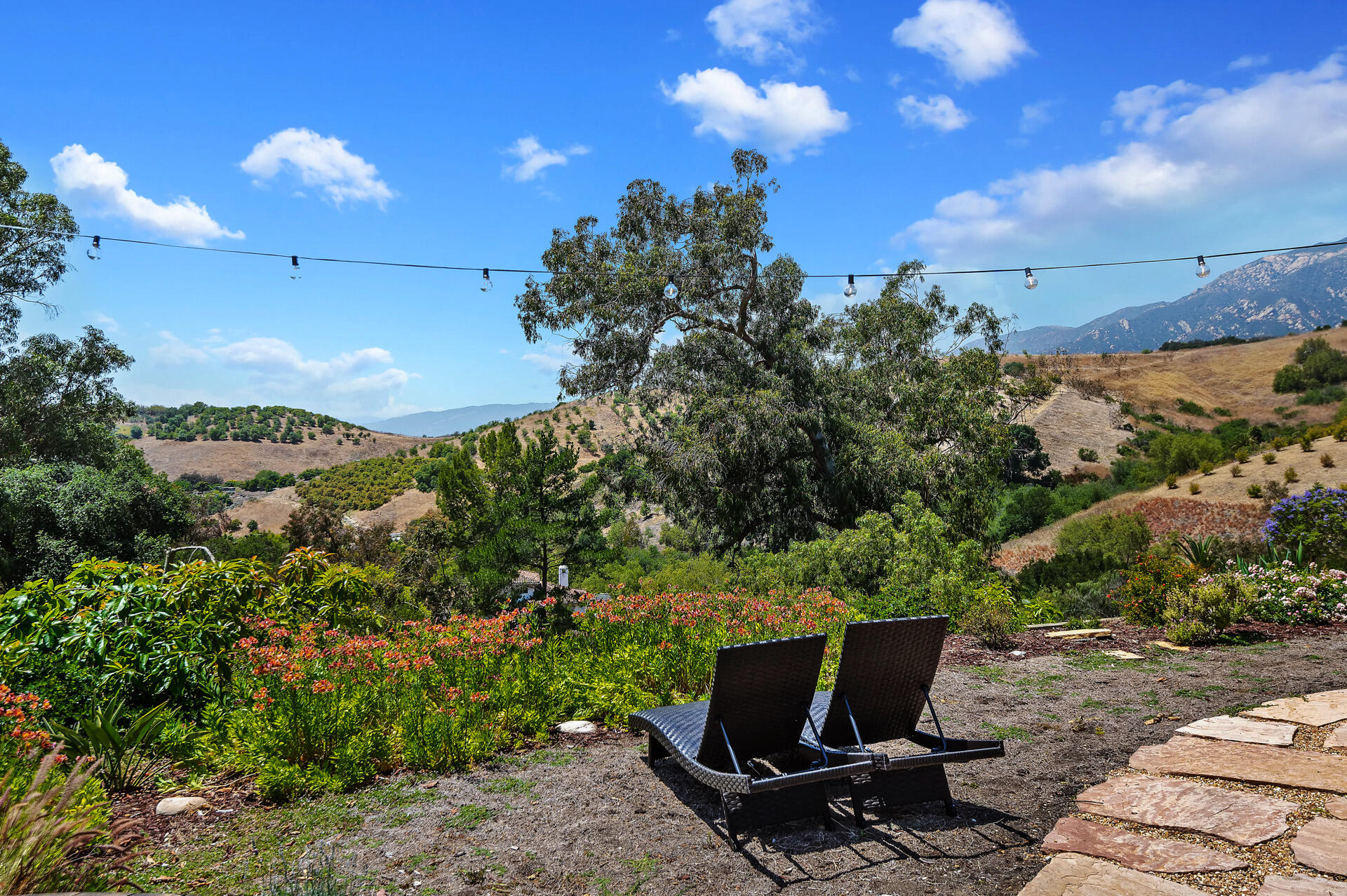 Undisclosed Address Santa Barbara, CA 93105 - Photo 12 of 30 a view of a terrace with a garden and mountain view