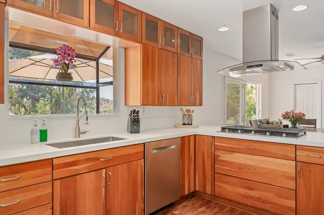 a kitchen with a sink and cabinets
