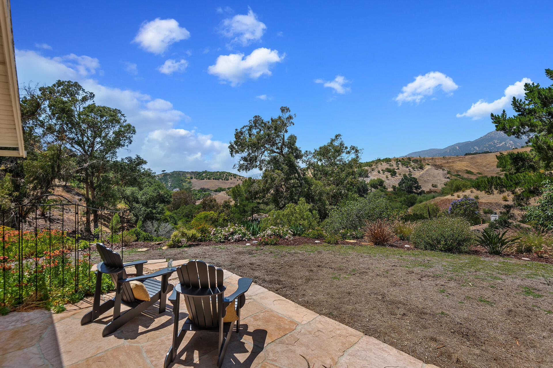 Undisclosed Address Santa Barbara, CA 93105 - Photo 26 of 30 a view of a chairs and table in the backyard