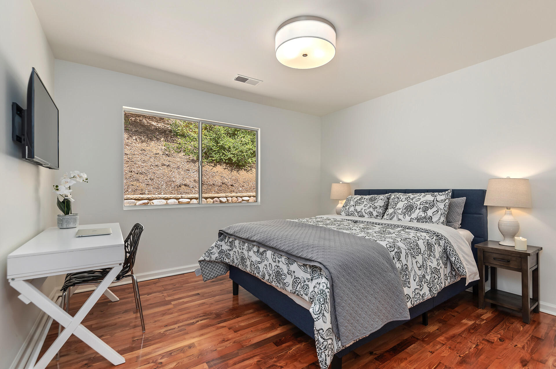 Undisclosed Address Santa Barbara, CA 93105 - Photo 29 of 30 a bedroom with a bed and a flat screen tv