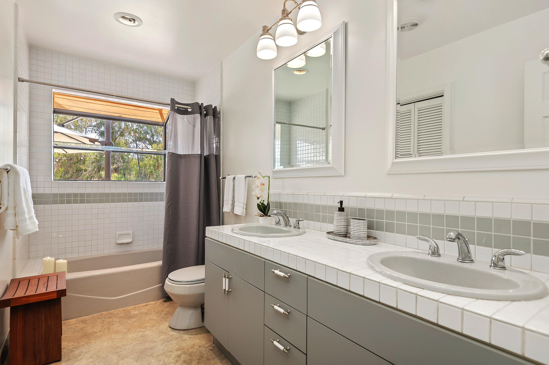 Undisclosed Address Santa Barbara, CA 93105 - Photo 30 of 30 a bathroom with a double vanity sink toilet mirror and bathtub