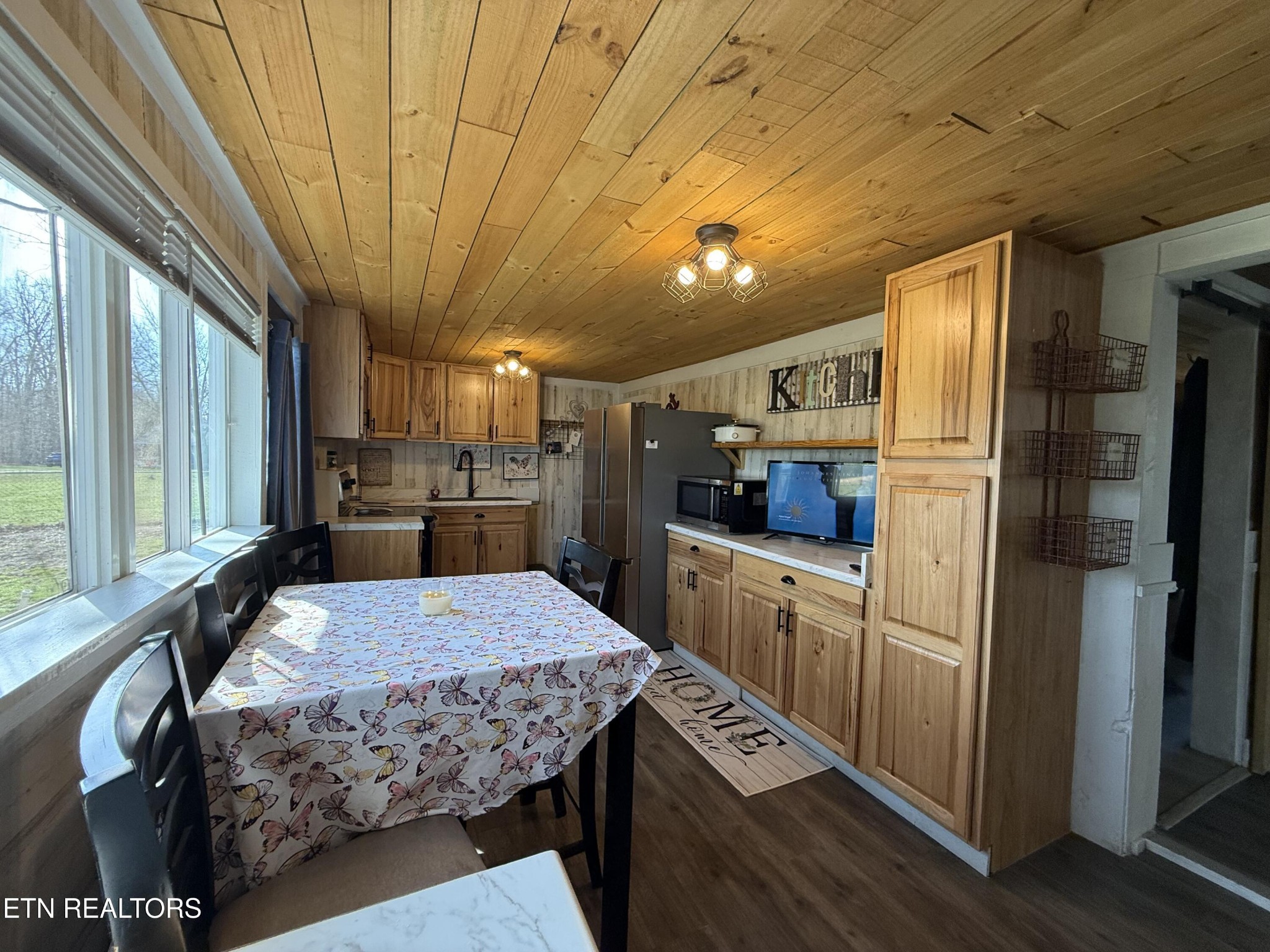 1995 Clarkrange Monterey Highway Monterey, TN 38574 - Photo 12 of 29 a kitchen with stainless steel appliances kitchen island granite countertop a refrigerator a stove a sink dishwasher and cabinets with wooden floor