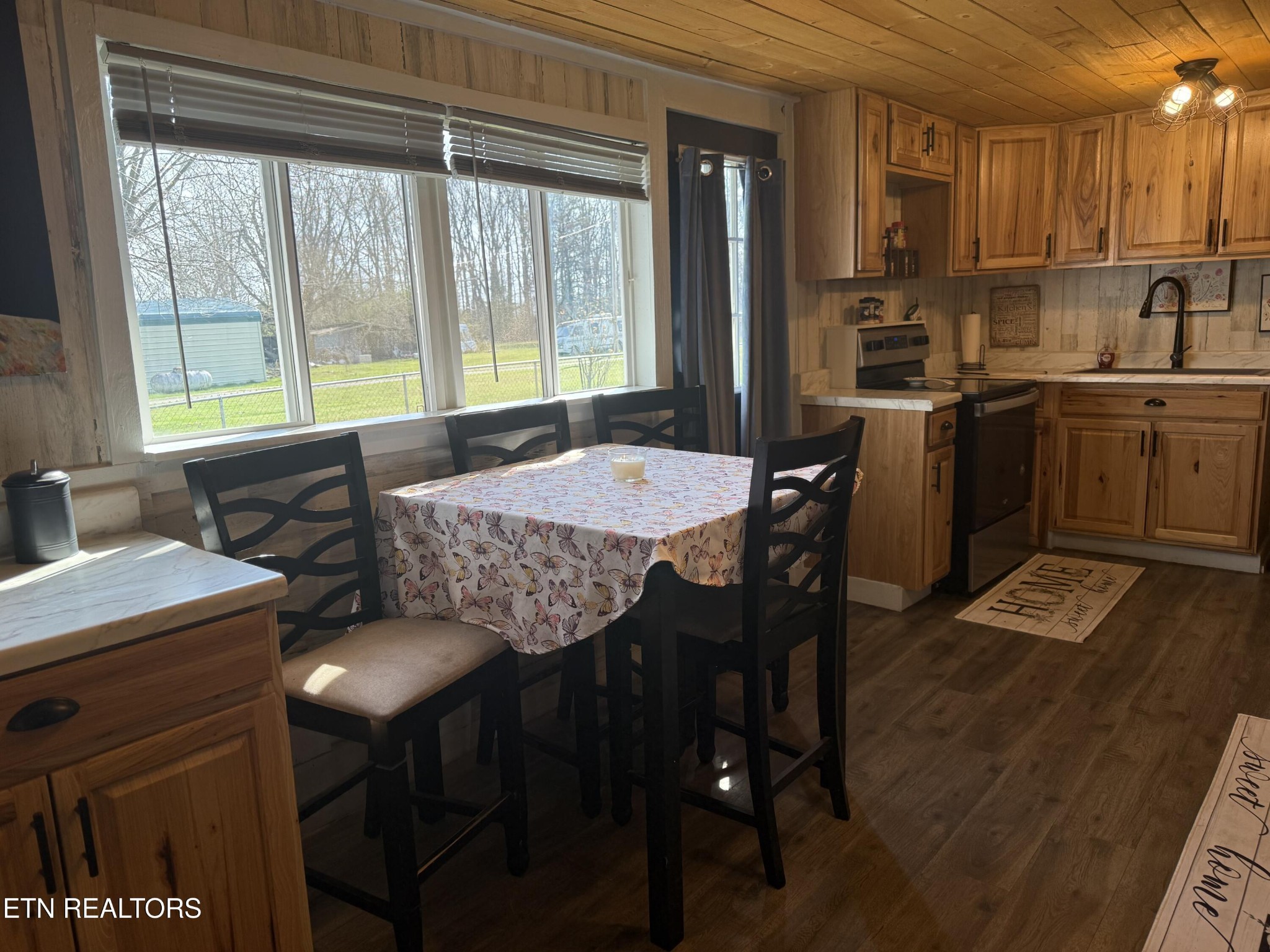 1995 Clarkrange Monterey Highway Monterey, TN 38574 - Photo 9 of 29 a kitchen with granite countertop a sink dining table and chairs