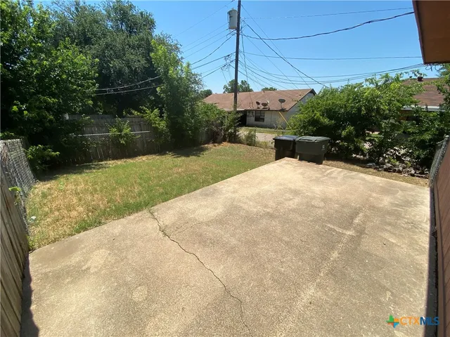 a view of a backyard of the house
